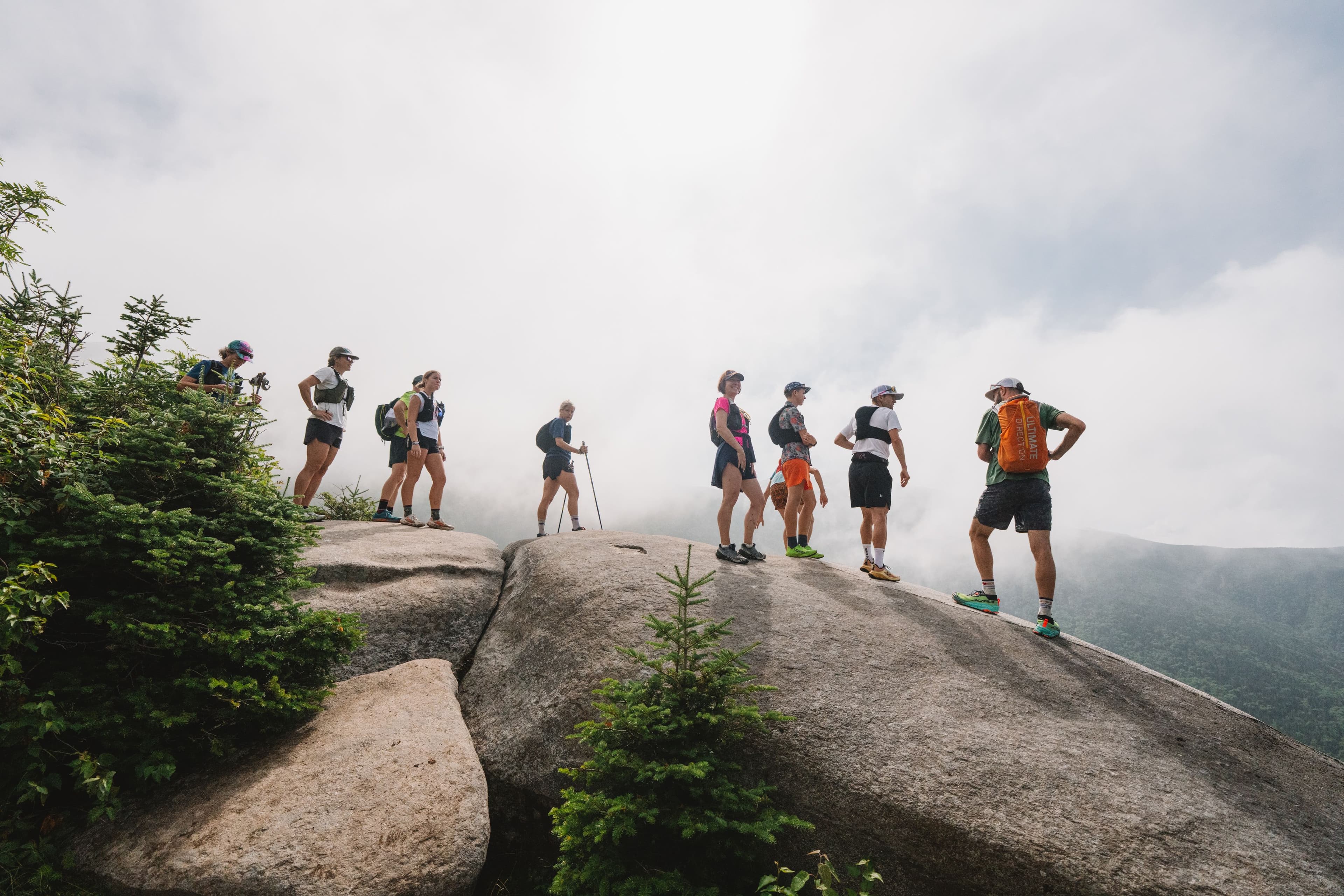 Runners standing on a rock